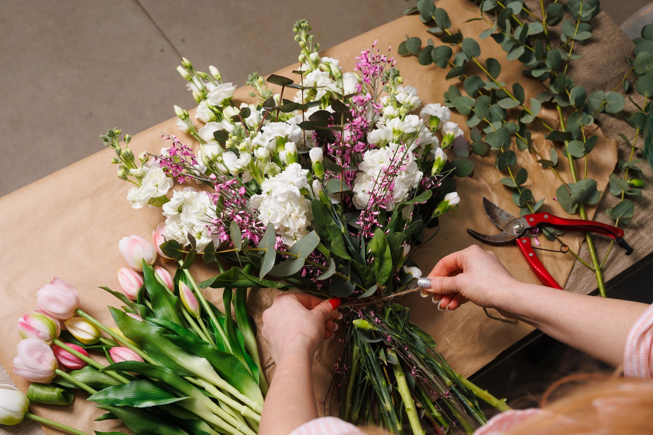 Florist hands arranging a bouquet